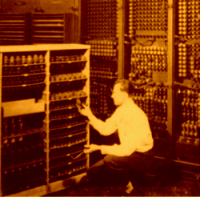 Technician changes a tube in ENIAC
