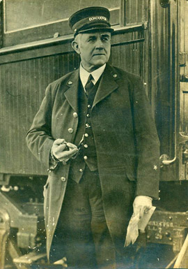 UP Conductor checks time, W.T. Horne photograph